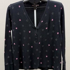 Cozy Victoria’s Secret waffle knit henley top with an allover heart print.